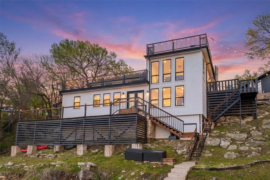 Welcome to a rare Fort Worth treasure where architecture, adventure, and awe-inspiring views collide. Perched above the shimmering expanse of Lake Worth, this retreat delivers a lifestyle that feels more like a year-round vacation than a home. A Three-Level Sanctuary with Four Incredible View Decks. Every level of this 3-bed, 3-bath masterpiece is designed to frame the lake in all its glory. Sunrise coffees, sunset cocktails, stargazing nights — the four expansive decks give you front-row seats to it all. Whether you’re entertaining a crowd or savoring a quiet moment, the views are nothing short of breathtaking. Entertainment Paradise - This property was built for unforgettable gatherings. A custom fire pit for late-night conversations, Multiple outdoor living zones, Seamless indoor-outdoor flow, Space for hosting on every level. It’s the kind of home where weekends turn into memories and guests never want to leave. Bring the Toys: A 32-Foot Garage Awaits - Lake life demands gear, and this home delivers the space to store it. A massive 32-foot garage easily houses boats, jet skis, kayaks, and all your lake toys. Recently upgraded with a large-capacity electric boat lift system rated for 6 tons, it’s built for convenience, capability, and serious fun. This is not a leasehold property — it is privately owned, deeded, and secure behind a gated entrance. Peace of mind and privacy come standard. Lake Worth is one of the rare North Texas lakes known for stable water levels year-round, giving you reliable access to boating, fishing, and waterfront living without the seasonal guesswork. 4401 Clarke Dr isn’t just a home — it’s a lifestyle, a vantage point, and a personal resort wrapped into one extraordinary property. If you’re looking for a place where every day feels like a getaway, this is the one that stands above the rest. Current FEMA Maps indicate home is in 500-year flood plan and DOES not require flood insurance.