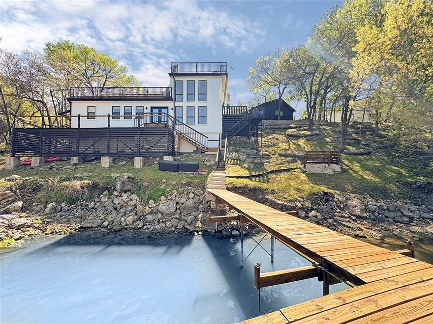 Welcome to a rare Fort Worth treasure where architecture, adventure, and awe-inspiring views collide. Perched above the shimmering expanse of Lake Worth, this retreat delivers a lifestyle that feels more like a year-round vacation than a home. A Three-Level Sanctuary with Four Incredible View Decks. Every level of this 3-bed, 3-bath masterpiece is designed to frame the lake in all its glory. Sunrise coffees, sunset cocktails, stargazing nights — the four expansive decks give you front-row seats to it all. Whether you’re entertaining a crowd or savoring a quiet moment, the views are nothing short of breathtaking. Entertainment Paradise - This property was built for unforgettable gatherings. A custom fire pit for late-night conversations, Multiple outdoor living zones, Seamless indoor-outdoor flow, Space for hosting on every level. It’s the kind of home where weekends turn into memories and guests never want to leave. Bring the Toys: A 32-Foot Garage Awaits - Lake life demands gear, and this home delivers the space to store it. A massive 32-foot garage easily houses boats, jet skis, kayaks, and all your lake toys. Recently upgraded with a large-capacity electric boat lift system rated for 6 tons, it’s built for convenience, capability, and serious fun. This is not a leasehold property — it is privately owned, deeded, and secure behind a gated entrance. Peace of mind and privacy come standard. Lake Worth is one of the rare North Texas lakes known for stable water levels year-round, giving you reliable access to boating, fishing, and waterfront living without the seasonal guesswork. 4401 Clarke Dr isn’t just a home — it’s a lifestyle, a vantage point, and a personal resort wrapped into one extraordinary property. If you’re looking for a place where every day feels like a getaway, this is the one that stands above the rest. Current FEMA Maps indicate home is in 500-year flood plan and DOES not require flood insurance.