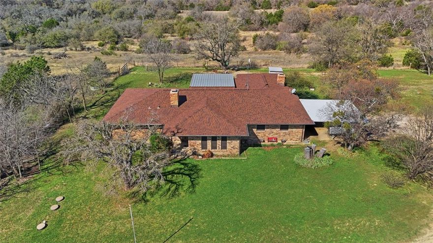 Perched atop one of the highest points in Parker County, this scenic property offers sweeping views and a rare opportunity to own land that has been cherished by the same family for generations. The setting is both peaceful and picturesque, with mature hardwood trees providing shade, privacy, and abundant wildlife habitat. Ideal for outdoor enthusiasts, the property is perfectly suited for hunting and recreation, with NO RESTRICTIONS. A pond stocked with fish creates a relaxing spot to cast a line, while a creek running along the back of the property adds to the natural beauty and attracts wildlife throughout the year. The home offers comfortable living with thoughtful updates. Whether you’re looking for a private retreat, a hunting property, or a place to continue a family legacy, this unique property offers breathtaking views, mature trees, and a setting that captures the best of Parker County country living.
