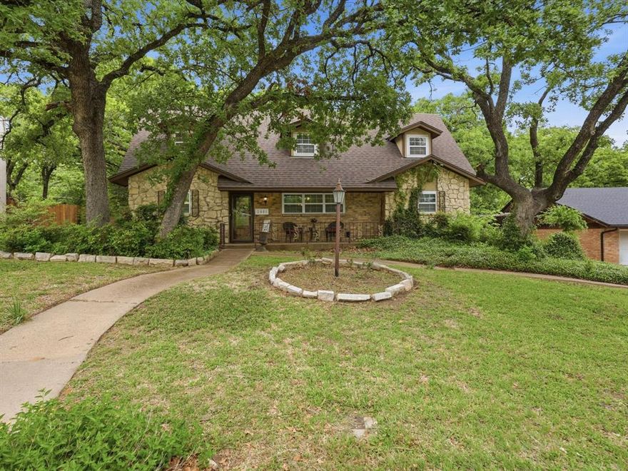 Welcome to this beautifully maintained 4-bedroom, 2.5-bath home, ideally situated under the shade of mature trees in the highly desirable Oaks of Arlington neighborhood. The home boasts two living areas, including a sun-drenched family room that floods the space with natural light, creating a perfect spot to relax or entertain. The family room and formal living room both feature custom built-in cabinetry and elegant crown molding, offering timeless style and functionality. The spacious dining room is equally impressive with its own custom cabinetry, providing a perfect blend of form and function for hosting family meals or dinner parties. The kitchen is equipped with granite countertops, stainless steel appliances, and a convenient breakfast bar for casual dining. The master suite is a true retreat with a ensuite bath and walk-in closet. Upstairs, the oversized bedrooms provide ample space for children, guests, or those working from home. Step outside into your own private oasis. The expansive backyard offers a charming fully functional wood-burning pizza oven, perfect for hosting gatherings. Surrounded by lush greenery, this serene setting offers a cabin-like feel, complete with a spacious brick-paver patio to unwind and enjoy the outdoors. With a brand-new roof installed in 2025, this home combines style, comfort, and peace of mind. Don't miss the opportunity to make this stunning property yours!