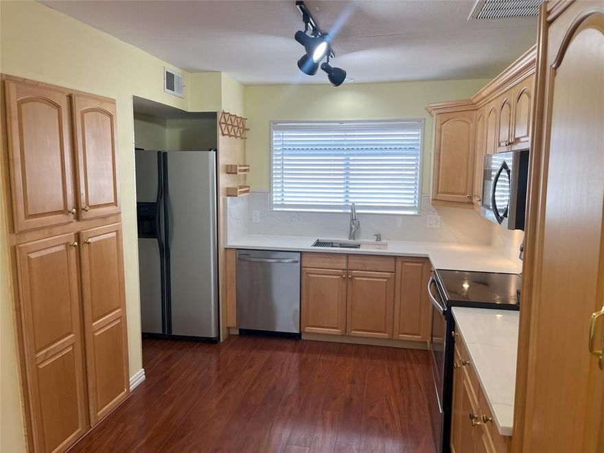 Nicely updated spacious condo with attached garage. Condo is situated in a very nicely kept complex in far North Dallas with Plano ISD schools. Some of the updates include new HVAC system, quartz countertops, SS appliances, laminate flooring and LED lighting. Condo features open floor plan with kitchen, living and dinning areas creating spacious light space. Washer and dryer and refrigerator convey with the property. Condo is on the second floor with attached garage accessed through the small fenced yard.