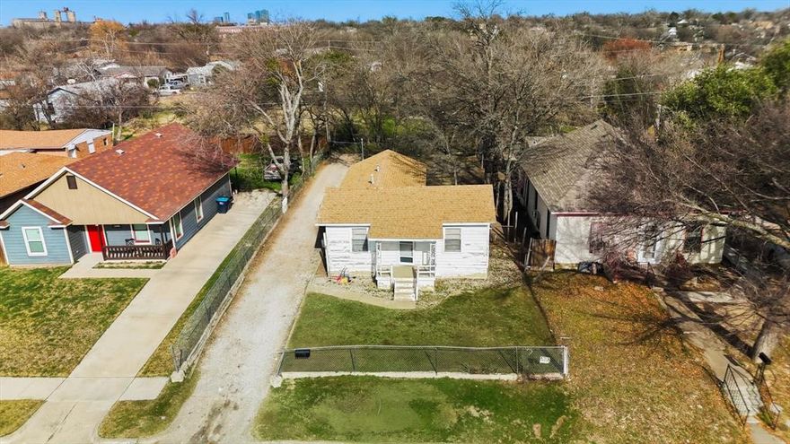 MULTIPLE OFFERS RECEIVED! HIGHEST AND BEST DUE MONDAY, JANUARY 12TH AT 6:00PM. 

A RARE CANVAS with exceptional upside potential! This 2-bedroom, 1-bath home sits on a large lot with an expansive backyard and extra-large driveway, offering flexibility for renovation, expansion, or future redevelopment. The home features separated rooms, providing a functional layout for a thoughtful redesign. 

Located near I-35 and minutes from Downtown Fort Worth, the area is evolving with improvements that set the stage for future growth with many newly built homes nearby, making this a strategic investment for builders and investors. 

The lot alone presents strong value, with added upside from existing improvements including a roof replacement in 2015 and a newer water heater. A standout feature is that the sale includes mineral rights, a valuable bonus. Whether you’re looking to renovate, rebuild, or hold in a growing area, this property offers the opportunity to create something extraordinary. Bring your vision and turn this opportunity into something truly remarkable.