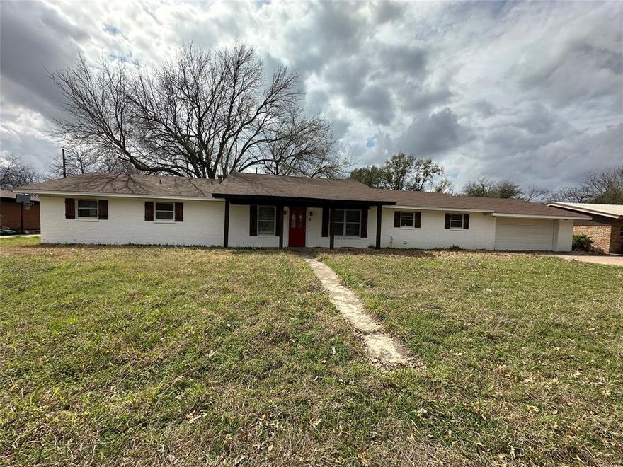 Welcome to this brick ranch style home featuring 3 bedrooms, 2 baths, 2 living areas and 2 car front entry garage.  This home offers a front living area that could also be used as flex space such as a home office. The kitchen is U shaped with a large dining area on one side and a another living space on the opposite side with a cozy fireplace and sliding glass door leading out to the backyard.  The primary bedroom offers it's own bathroom with a shower and the 2 secondary bedrooms offer ample space for family and guests.