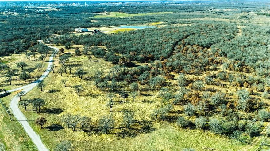 Now Offered at $1,999,999

RARE 93-ACRE TEXAS RETREAT – LUXURY, LAND & LIMITLESS LIFESTYLE

Welcome to your private sanctuary just outside Cisco, TX—a rare opportunity offering 93 acres of rolling terrain, scenic views, and peaceful living. With updated pricing, this extraordinary estate is now even more accessible to those ready to own a piece of Texas paradise.

The 5-bedroom, 3.5-bath home features a dedicated office or vanity room, spacious living areas, and a beautifully renovated kitchen with double islands, custom cabinetry, a walk-in pantry, and a large dining area. A whole-house water filtration system ensures clean, fresh water throughout.

The 5,600 sq. ft. multi-use shop adds tremendous value—fully equipped with a gym, sauna, epoxy flooring, two oversized roll-up doors, and a private full bath. This versatile space is perfect for a guest suite, studio, man cave, or entertainment hub with views of one of seven ponds.

Outdoors, enjoy a custom four-wheeler track, private walking trails, and abundant wildlife including deer, hogs, ducks, turtles, and native birds. The stocked main pond offers bass, bluegill, and perch fishing right on your own land.

Bask in breathtaking sunrises and sunsets that stretch across the open Texas sky. A custom chicken coop adds charm to the country lifestyle.

This is more than a property—it’s a lifestyle of freedom, space, and unforgettable moments.

Schedule your private tour today and experience the value of this one-of-a-kind retreat.