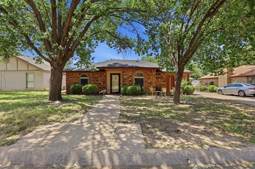 Looking for a home in Arlington, TX with flexible living space, modern updates, and convenient access to shopping, dining, entertainment, and major highways? Welcome to this well-maintained split-level home in the heart of Arlington, perfectly positioned between Dallas and Fort Worth and close to everything the DFW Metroplex has to offer. Step inside to warm laminate flooring and a functional layout designed for both everyday living and entertaining. At the front of the home, you'll find a formal dining area that could also serve as a home office, second living space, or study. The kitchen features granite countertops, ample cabinet space, and opens to the main living room, creating an inviting flow for gatherings and family time. The main level includes three spacious bedrooms, including one with a private en suite bathroom that could function as a primary suite, along with an additional full bathroom. Upstairs, a separate private suite with its own en suite bathroom offers an ideal setup for a second primary bedroom, guest retreat, or multigenerational living. Downstairs, the walk-out basement provides endless possibilities for a game room, media room, office, craft room, workout area, or additional flex space. Situated on a large lot with plenty of room for kids, pets, and outdoor entertaining, this property also features a detached 2-car garage with extra storage space in the rear. Major updates include a Class 4 impact-resistant roof replaced in 2025 and an HVAC system replaced in 2024 with new ductwork installed. If you're searching for a unique Arlington home with character, space, and modern improvements in a prime DFW location, this is one you don’t want to miss.