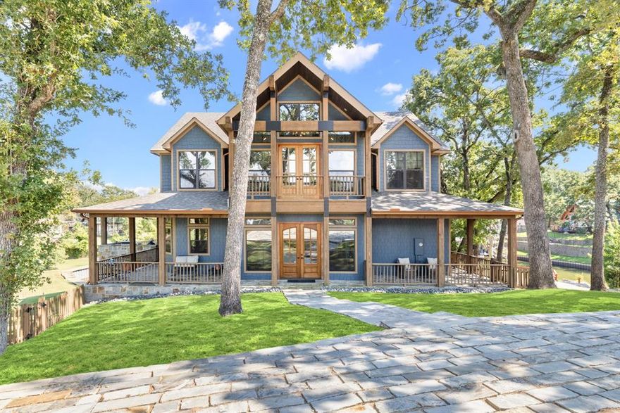 Set on the coveted shores of Cedar Creek Lake, this five-bedroom, three-and-a-half bath masterpiece redefines lakefront living with 2,933 square feet of refined comfort and style. Showcasing rustic elegance at its finest, the home features dramatic ceilings, striking wood and stone accents, and an open floor plan wrapped in windows that capture dazzling water views from every angle.
Designed for both grand entertaining and relaxed living, the residence offers multiple patios, a wraparound porch, and an expansive backyard anchored by a lakeside firepit. Whether hosting sunset dinners by the built-in outdoor grill, enjoying morning coffee on the porch, or gathering under the stars, every moment here feels like a private retreat.
Direct access to the water elevates the experience, with a private boat ramp and dock offering endless opportunities for boating, fishing, and waterfront leisure. After a day on the lake, retreat to your serene patios or welcome guests with ease thanks to ample parking and thoughtfully designed outdoor spaces.
Rarely does a home of this caliber become available—combining rustic charm, modern luxury, and unrivaled lakefront access in one of the area’s most desirable settings. Perfect as a year-round residence or a luxurious getaway, this property represents the pinnacle of Cedar Creek living.