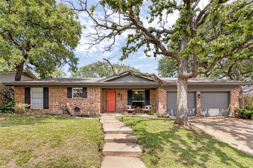 Don't miss this spectacular 3 bed, 2 bath home minuets from Lake Arlington!  The living room has a cozy brick fireplace and the attached dining area has a built-in desk with shelves.  A bonus room makes a great sunroom or an office, both of which are perfect for WFH!  The stunning kitchen boasts a center butcher block and stainless steel appliances with an attached breakfast nook.  Laundry will be a breeze with a separate utility room and room for full sized washer and dryer.  New owners will love the spacious primary bedroom with an en-suite bath.  The large backyard is perfect for entertaining.  This home won't last so make sure to schedule your tour today!