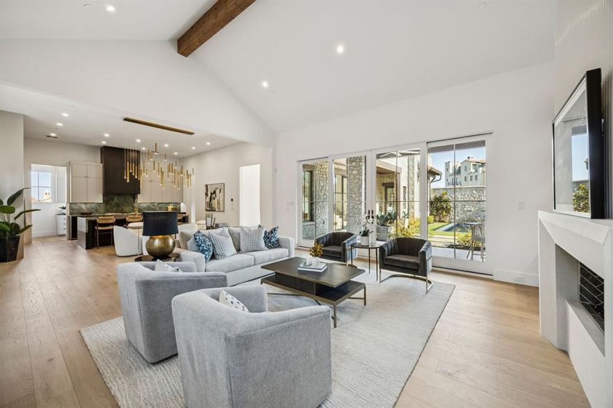 Discover the epitome of elegance in this Mediterranean-inspired masterpiece, crafted by renowned builder Heritage Homes, spans 5,098 square feet of artfully designed living space. Nestled in the coveted Westlake, Entrada neighborhood, this stunning two-story residence offers an inviting retreat for discerning buyers, featuring five generously sized bedrooms and five-and-a-half luxurious bathrooms.

Upon entering through the private courtyard, be captivated by the seamless blend of sophistication and functionality. The expansive living areas are bathed in natural light, creating an ambiance of warmth and serenity. Entertaining is a delight with an outdoor kitchen, cozy fireplace, and a custom plunge pool with water feature. The home showcases unique cabinetry and stunning tile work throughout, each element meticulously crafted to offer a touch of modern elegance and timeless comfort that enhances the allure of each room.

The gourmet kitchen is a chef's dream, equipped with stainless steel appliances, including a professional-grade 48-inch gas range, a 60-inch Thermador refrigerator freezer, a wine fridge, and a prep kitchen with a sink, ice maker, and second dishwasher. Retreat to the gorgeous private master suite featuring custom cabinets, freestanding soaking tub, and custom walk-in closet.

Additional features include a laundry room with built-in storage and dog wash, optional space for an elevator lift from the garage level to the first floor. This home is a harmonious blend of luxury and practicality, ready for you to secure your piece of paradise today. Zoned for both Carroll ISD and the International Baccalaureate Westlake Academy.