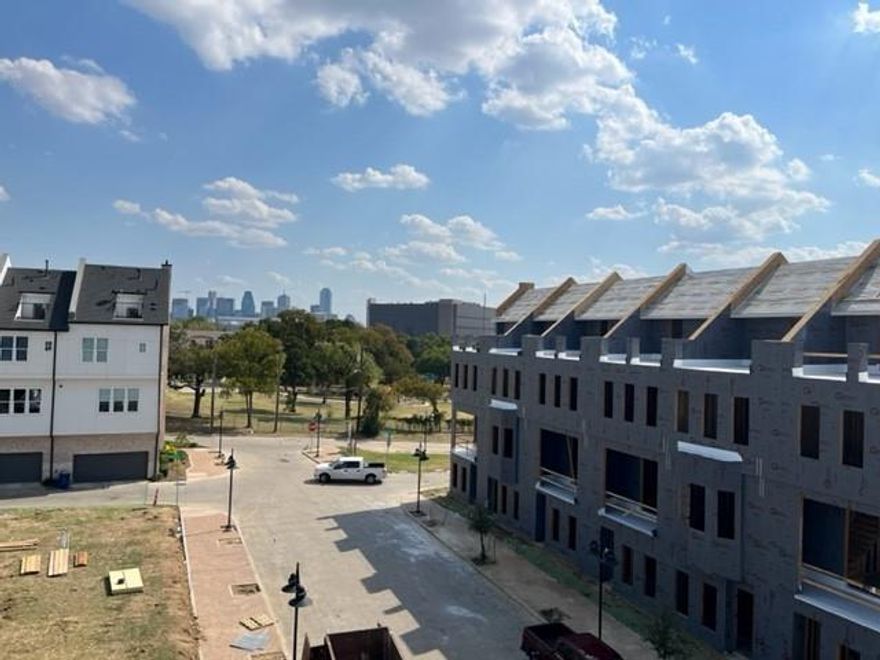 ROOFTOP SKYLINE VIEW!  LOCK IN LOW INTEREST RATE NOW WITH $10,000 SELLER CLOSING COST CONTRIBUTION!  Chic secluded community with classic brick architecture and community pool! Gourmet Kitchen features 3 sizeable windows, SS Bosch appliances, , SS sink, luxurious soft close cabinets, quartz countertops, epic 12ft ceilings! High end finishes throughout include wood floors, Hansgrohe plumbing fixtures, contemporary cabinets w hardware, 8 ft doors and green features such as tankless water heaters. UNCOVERED ROOFDECK ON 4TH LEVEL! END UNIT!  Minutes from the heart of Oak Lawn and Uptown, Love Field and Medical District. HOME IS UNDER CONSTRUCTION AND EXPECTED TO BE MOVE-IN READY BY JULY 2023. LOW HOA! SEE WEBSITE .