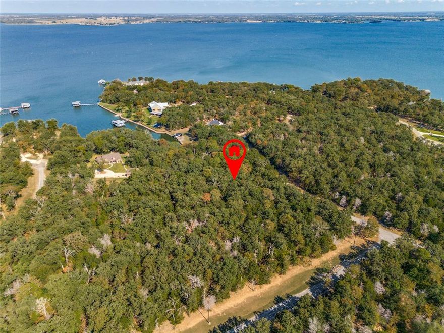 Discover the unparalleled beauty and tranquility of lakefront living with this exceptional offering at Richland Chambers Lake. Nestled within the prestigious The Woods subdivision, this 4.95-acre property is a fusion of privacy, natural beauty, and accessibility.
Comprising two spectacular lots, this parcel provides a rare combination of extensive lakefront access and the seclusion afforded by mature hardwood trees. Imagine crafting your dream home amidst this serene landscape, where every window captures stunning views of the lake and the surrounding woodland.
With substantial road frontage, access to both lots is seamless, ensuring convenience without compromising the harmony of the natural setting. This is more than just land; it's an invitation to create a lifestyle of peace, luxury, and connection with nature.
Seize the opportunity to own a piece of paradise in one of the lake's finest communities. Experience the ultimate in lakeside living and make your dream home a reality today