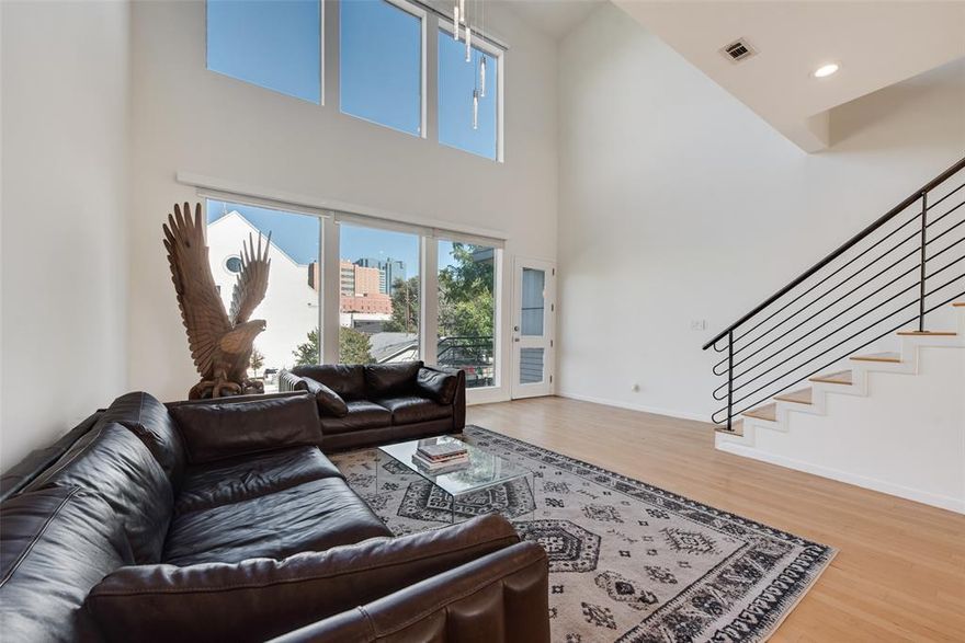 Stylish downtown Fort Worth loft with fresh updates throughout, including new interior paint and lighting. The open-concept main living area features soaring ceilings, oversized windows for abundant natural light.The kitchen connects seamlessly with the living space, offering granite counters, bar seating, stainless steel appliances, and plenty of cabinet storage for a functional yet inviting design.
This flexible floorplan includes a bedroom and ensuite bath on the main level, perfect for guests or a home office. Upstairs, the spacious loft-style bedroom offers privacy and includes a large ensuite bath with a jetted tub and separate glass-enclosed shower.
Enjoy skyline views from your private rooftop deck—an ideal spot for entertaining, relaxing, or catching the Panther Island fireworks. A two-car garage with EV charging adds everyday convenience to this lock-and-leave lifestyle.
With thoughtful updates and a prime location in the heart of downtown, this property blends urban style with modern comfort.