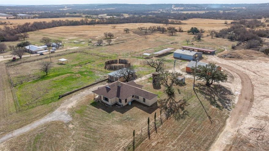 This charming ranch home is brimming with major potential, situated atop a beautiful 12+ acre property ideal for horse enthusiasts and investors alike. The land offers excellent ground for horses, with well-maintained pastures and multiple covered runs. A variety of outbuildings, including a garage, a spacious workshop, and a well-equipped barn, provide everything needed for equestrian or agricultural use. Perched on a hilltop, the home boasts breathtaking panoramic views, offering a peaceful and private setting while conveniently located near Morgan Mill. Inside, the house retains its vintage charm, featuring original wood flooring, a cozy fireplace in the expansive living area, and three bedrooms with the flexibility to function as a four-bedroom. Whether you're looking to create your dream horse property, fix and flip, or add value through sweat equity, this property offers endless possibilities. Its desirable location and equestrian-ready setup make it a rare and valuable investment opportunity. The property is being sold as is. Don't miss out on this gem!