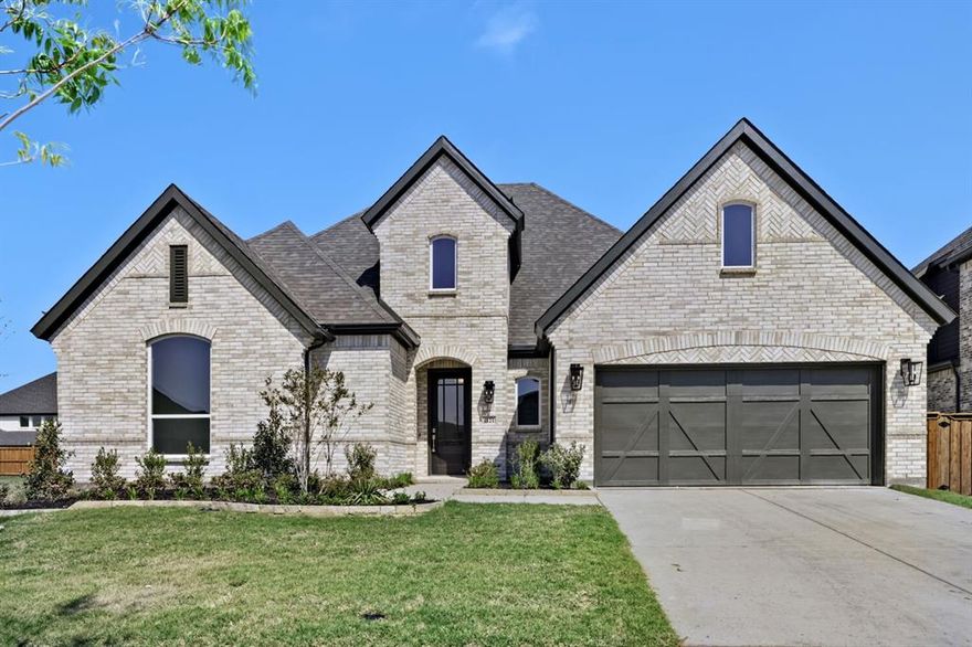 This stunning four-bedroom, one-story home has it all, a media room, home office, open kitchen and dining with a private main suite in the back of the house. As you enter the foyer, you will find two and three bedrooms along with their shared full bathroom. Across the hall is the media room that is next to the mud room off the garage. Towards the end of the foyer is the spacious home office, powder bathroom and laundry room. The family room is complete with a fireplace and a wall of windows that faces the outdoor living space. This flows into the kitchen and dining area. Bedroom four is located off the living room with its own full bathroom and walk-in closet. The secluded main bedroom includes a large bathroom with dual vanities, walk-in shower, bathtub and two walk-in closets. The outdoor living space is great for the grilling chef to entertain. The 3-car tandem garage is a plus!
