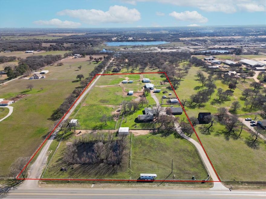 Introducing a one-of-a-kind property that seamlessly combines the beauty and tranquility of Equestrian living with the convenience of suburban life. Situated on 10.59 acres, this stunning property offers a rare opportunity to enjoy the best of both worlds. The property features a 3029 sq ft. spacious main residence with a 3-bedroom, 3-bath, 3-car heated and air-conditioned garage. 2 primary suites, both with large walk-in closets and ensuite baths.  Additional features include large windows, a gourmet kitchen, ample cabinet space, and a large island perfect for entertaining. Spacious living and dining area with fireplace, cedar closet and 2 laundry areas.  A second 1 bedroom, 1 bath guest home with garage would make a perfect in-law home or rental. The property has adequate space for riding and training activities, including an arena, round pen, 7-stall barn, equipment barn, 5 loafing sheds, and a pond.  See documents for additional features.