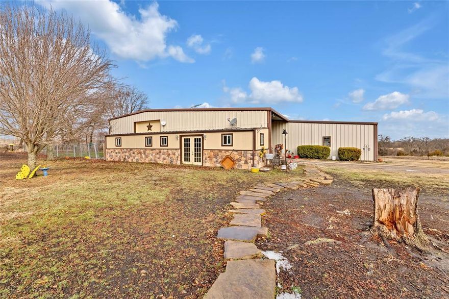 Experience the perfect blend of Texas country living and custom craftsmanship at this exceptional barndominium set on 13.34 sprawling acres in Howe. With room to roam, work, and play, this property offers incredible versatility for those seeking privacy, space, and functionality without sacrificing comfort. So much room to add animals, livestock, bees, gardening or even an orchard to make this Ag exempt, or you can build whatever you want. A rare opportunity to own a truly unique property with acreage, an active tree-lined creek, pool, and off of the beaten path for complete privacy and seclusion. Thoughtfully designed, this custom-built barndo offers 3 bedrooms and 2 full baths with one sharing the laundry room making it very spacious. The kitchen has tons of cabinets, with a little cute island to cook up those down home meals. The large living room is perfect for hosting those family traditions. The expansive 6-car attached garage is every man's dream as it provides endless space for vehicles, toys, or a workshop, complemented by an additional 2-car carport for added convenience right there at the door, where they happen to love to keep their mandatory John Deere tractor. Step outside to your completely private outdoor country oasis featuring an in-ground gunite pool and a covered outdoor party bar, perfect for entertaining, relaxing, or enjoying wide-open Texas sunsets or floating in that pool under all those bright stars. Outdoor possibilities will keep you outside all the time. For those animal lovers, they enclosed a room for the dogs to stay when not home, accessed by the doggie door when they don't want them in the backyard. No muddy paws on those rainy days and nights.  This property has everything you need with room to grow.