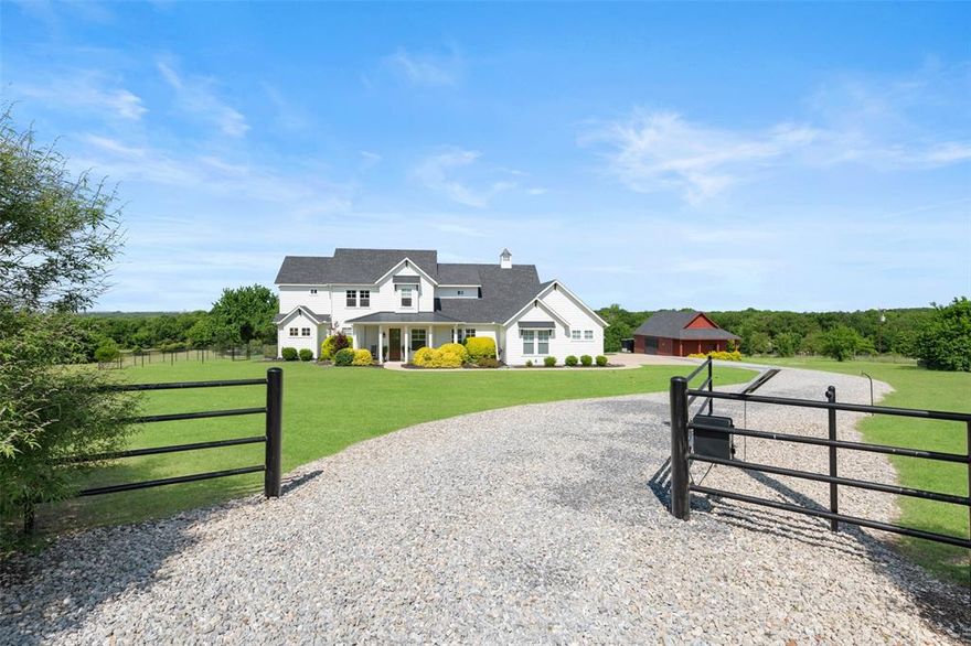 Nestled on nearly 10 acres, this 4-bed, 4-bath farmhouse offers a serene country lifestyle while maintaining convenient access to nearby city amenities. Built in 2017 and boasting an agricultural exemption, the home welcomes you with a spacious open floor plan, high ceilings, and warm hand-scraped hardwood floors accentuated by charming wood beams. A gas fireplace creates a cozy focal point in the main living area, while abundant windows fill every room with natural light. The gourmet KitchenAid-equipped kitchen showcases a 6-burner gas cooktop, farmhouse sink, pot filler, paneled built-in refrigerator, and a large sized island topped with beautiful quartzite. Each of the four bedrooms has its own bathroom, and there are thoughtful conveniences throughout—like marble-accented baths, a theater room with built-in surround sound, a second living area upstairs, a laundry chute, electric shades in the primary bedroom and kitchen, smart home features, a discreet storm-safe room, a camera system, and an underground propane tank.

Outdoors, you’ll find a private oasis complete with a pool, diving board, and hot tub. A covered patio with a built-in grill, fireplace, retractable electric screens, and integrated sound system. A three-car garage and a half-insulated, heated, and air-conditioned barn offer flexible space for vehicles, projects, or agricultural needs. Other highlights include a gated entry, mature trees, and a sprinkler-fed lawn within the immediate area of the house. With quick access to major highways such as U.S. 75 and U.S. 380, you’re just minutes away from shopping, dining, and vibrant local attractions like Historic Downtown McKinney, Bonnie Wenk Park, and Adriatica Village. Experience the best of both worlds in this tranquil country retreat—spacious rural living paired with the convenience of a thriving city just minutes away.