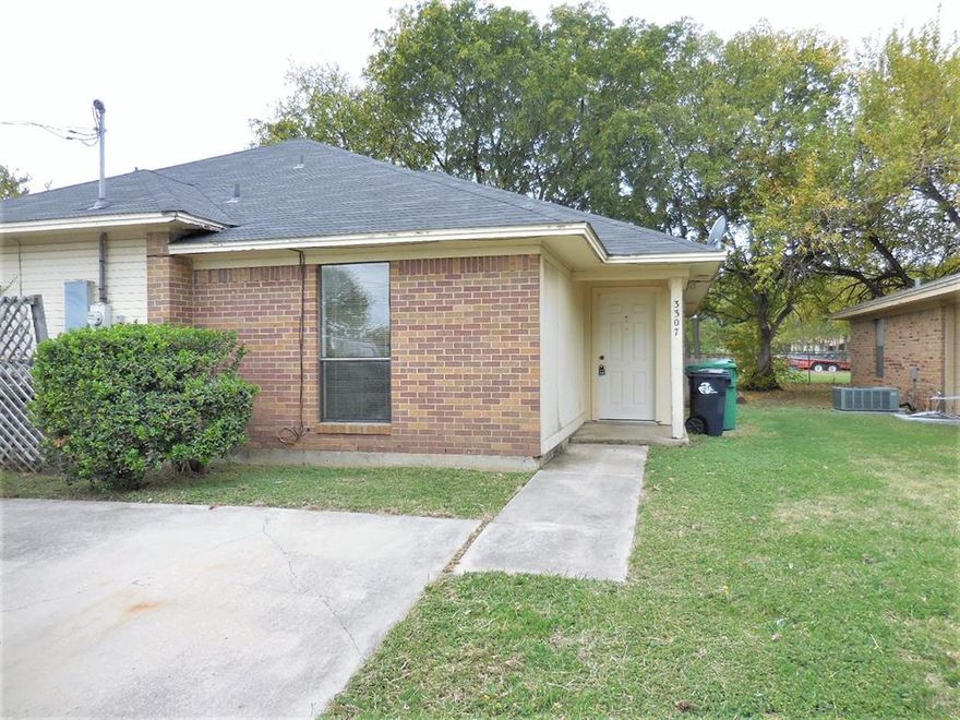 Nice half duplex with 2 bedrooms and 2 full baths. Carpet in the bedrooms and wood-look laminate in the living room. Includes dishwasher, range and disposal, covered patio in back, yard backs to field. Walk-in closet in master. Parking pad in front, plus street parking.