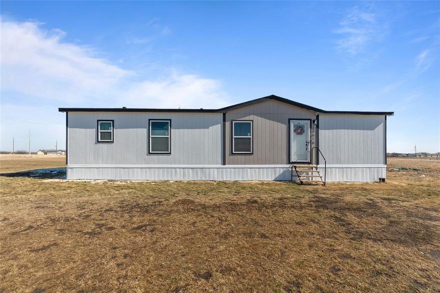 This beautifully maintained home offers the perfect blend of modern comfort and peaceful country living. Situated on a spacious lot, this property features an inviting open-concept layout with abundant natural light, neutral finishes, and durable wood-look flooring throughout the main living areas.
The heart of the home is the stylish kitchen, complete with ample cabinetry, a large center island, stainless steel appliances, and a seamless flow into the living and dining spaces—ideal for everyday living and entertaining. The living room provides plenty of space to relax, while the dining area is perfectly positioned near large windows overlooking the open land beyond.
The primary suite is generously sized and offers a private retreat with a spacious ensuite bathroom featuring dual sinks, modern fixtures, and plenty of storage. Additional bedrooms are well-appointed and versatile for family, guests, or a home office.
Outside, enjoy wide-open views and room to make the space your own—whether that’s adding a shop, garden, or simply soaking in the quiet Texas sunsets. Located in Godley ISD with easy access to town conveniences while still enjoying a rural feel, this property offers the best of both worlds. Call today to schedule a showing