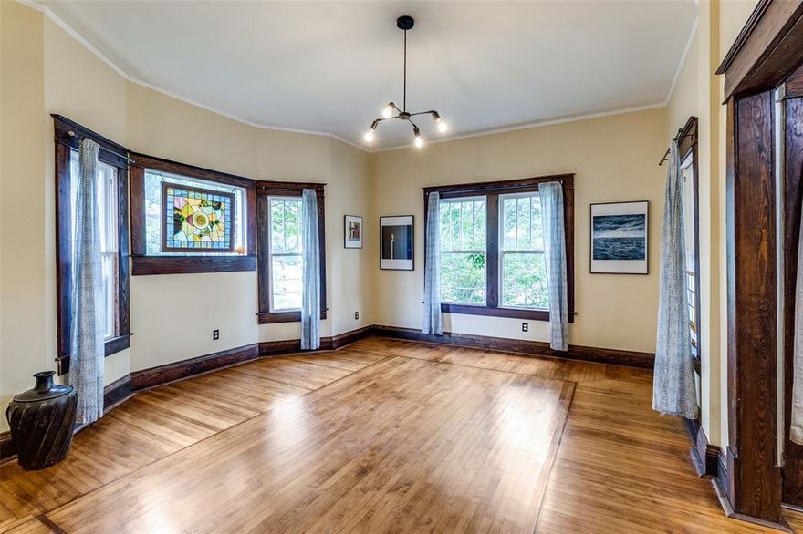 Truly a remarkable property located in the heart of the Munger Place neighborhood. This splendid American Foursquare home was custom-built in 1913 for Dr. David L Bettison and offers a blend of historical significance and thoughtful architectural design. American Foursquare homes are celebrated for their sensible and efficient use of space, a quality clearly evident throughout this residence. You'll be captivated by the beautiful, richly stained maple inlaid floors featuring a unique pattern that adds a touch of elegance and character to the home. The floor plan has been carefully maintained to honor its original design while seamlessly integrating modern amenities for comfortable living. The eat-in kitchen is a delight, boasting soapstone countertops, stainless steel appliances, and ample cabinet space. All bathrooms have been tastefully updated; one features Marmoleum flooring, which offers a vintage aesthetic with modern sustainability. The multiple living spaces within the home ensure privacy and tranquility, providing peaceful retreats from a busy lifestyle. Nestled in the middle of the block, away from busier streets, this location fosters a strong sense of community that extends beyond casual greetings. The Munger Place Homeowners Association has cultivated this spirit for many years through various annual and recurring neighborhood events. Residents enjoy longstanding traditions such as the annual home tour, also known as the wine walk, highlighting the unique charm of the neighborhood. Additionally, regular porch parties offer relaxed opportunities for neighbors to socialize. Annual 4th of July and other holiday parties are always popular events, enjoyed by residents of all ages. This property's location in the Munger Place neighborhood also provides convenient access to downtown Dallas, Baylor Hospital, Lower Greenville, as well as a variety of retail and restaurant options.