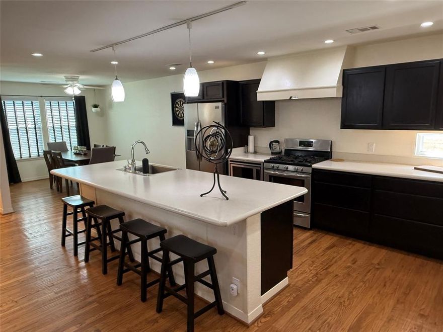 REDUCED...Modern charm meets timeless character in this fully renovated East Dallas gem near the Dallas Arboretum and White Rock Lake.  This 3-bedroom, 2 bath home blends classic hardwood floors with sleek, contemporary finishes.  The kitchen, dining and living room are all open and spacious. The oversized island features large stainless farmhouse sink, gas stove with 5 burners, walk-in pantry and stackable washer-dryer closet.  The primary bedroom is split from the guest bedrooms and features a walk-in closet and private bathroom.  All bedrooms have ceiling fans.  Guest bath has linen closet behind the door.  Coat closet at the entry and another in the hallway to bedrooms.  Every detail has been thoughtfully upgraded: electric panel replaced with new wiring, cast iron plumbing replaced with PVC under the house as well as to the alley, gutters added, 8' wood board on board fence across back yard, 6' wood fence on sides and front, patio cover and wood deck, Tuff storage shed, tankless hot water heater, double paned windows (can be cleaned from inside) and all updated appliances and lighting fixtures. HVAC replaced August 2024, foam insulation in attic for year-round efficiency, hardi plank exterior siding, prewired for cat5e cables for exterior cameras.