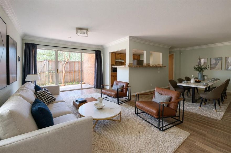 Step into this beautifully updated 2-bedroom, 2-bathroom condo featuring an open floor plan that seamlessly connects the kitchen, living, and dining areas. The kitchen boasts stunning granite countertops, providing both style and functionality for cooking and entertaining. Each spacious bedroom is thoughtfully placed on opposite sides of the unit for added privacy, complete with walk-in closets and updated bathroom vanities. The natural flow of  the living space makes it perfect for hosting or simply relaxing at home. Step outside to the inviting patio off the dining area, an ideal spot for a morning coffee, evening unwind, or even a small garden. With stylish updates and a well-designed layout, this condo offers comfort, convenience, and charm in one perfect package. Great central location just 10 mins from DFW Airport, Texas Live, AT&T Stadium and Rangers Stadium.