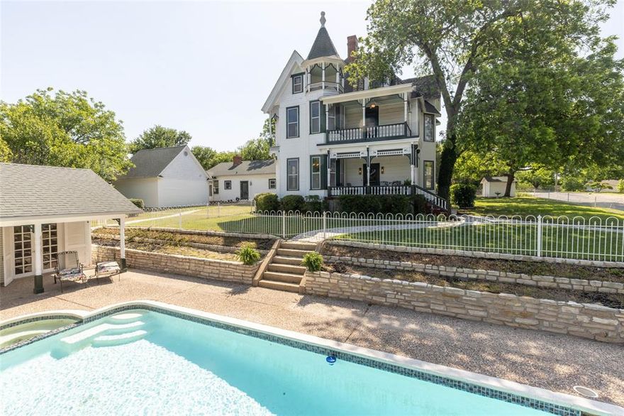 One of Weatherford's Grandest Mansion, the Barthold Home is a 129 year old Queen Anne Victorian. Edwin and his brother were German immigrants and came to Weatherford and operated a large mercantile business. Mrs. Barthold was an accomplished artist.  This grand home has original woodwork, 4 fireplaces with magolica tiles and incredible inlaid floors in all the formal rooms, 8 inch baseboards, original pocket doors, original chandeliers, stunning hardware. The home holds fast with it's original charm with a tankless water heater, central air, sprinkler system, 4 car garage, 2 attached and 2 detached. Host your sunsets with the gunite lap pool and 297 sq ft cabana which and has it's own bath, shower and 2 sitting areas. The home sits high on a hill and you can see the historic courthouse on the 3rd floor balcony in the winter. Just blocks away from downtown with gourmet restaurants and shops. 25 mins to Ft Worth, 55 mins to DFW Airport. This is the 5th family to occupy this home.