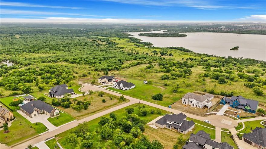 Build your dream home near Joe Pool Lake in the prestigious gated community of The Sanctuary at Lake Ridge. This generous .7-acre lot offers scenic views of the surrounding hills and a peaceful, upscale setting perfect for a custom build. Residents enjoy access to the Tangle Ridge Golf Club, parks with walking trails, and close proximity to Lynn Creek Marina, boat ramp, and clubhouse. Located just 30–45 minutes from Downtown Dallas, Fort Worth, DFW Airport, and Arlington’s premier attractions, this is an ideal location for luxury living with city convenience.