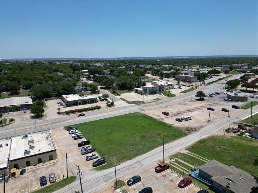 Empty commercial lot in an excellent location, near Hwy 161 and I30 as well as stable residential neighborhoods, medical clinics, grocery stores, ect.  Great accessibility and in a high traffic area with great visibility in the Hwy 161 Corridor. Zoned for general retail space. SB840 allows multi-family and mixed use. Call for more information. Survey is available.
