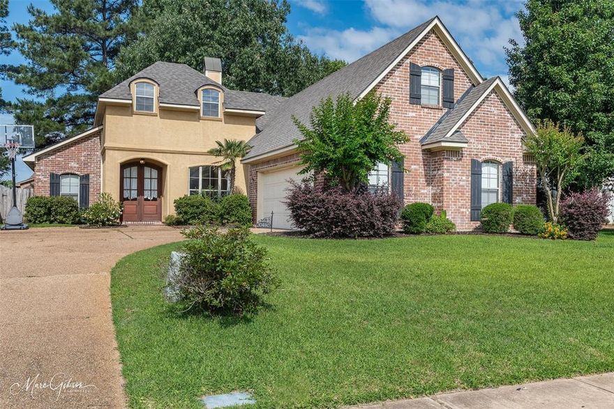 Located in the gated Norris Ferry Landing subdivision, this 4 bed, 3 bath home features a remote master suite downstairs for added privacy. The first floor also includes two additional bedrooms and a full bath, while the upstairs offers a private bedroom and bath—ideal for guests or teens. The kitchen boasts a center island, breakfast room, and separate dining area. Enjoy the covered back patio and the charm of this sidewalk-lined, family-friendly neighborhood.