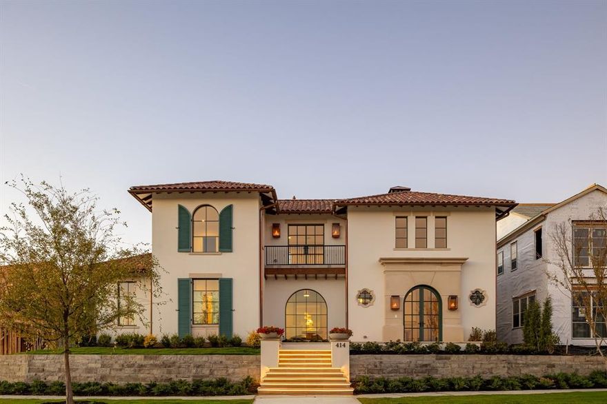 Welcome to The Preserve in Frisco, one of the nation’s most sought-after gated communities, set among rolling hills and anchored by two PGA championship golf courses. This exceptional custom home by Coats Homes showcases refined transitional design with the rare advantage of immediate move-in—offering elevated living without the wait. Santa Barbara-inspired architecture by Jerry Coleman pairs seamlessly with sophisticated interiors by Park Interiors, delivering remarkable craftsmanship, curated finishes, and premier amenities just moments from nature trails, dining, shopping, and world-class golf. Spanning 5,915 square feet, the home offers 5 bedrooms, 5 full baths, and 2 half baths, along with a game room, dedicated gym or media room, study, and an oversized three-car garage—all wrapped in an authentic barrel clay tile roof. A grand two-story entry makes an immediate impression, welcoming guests through steel doors onto limestone floors, where a fireplace and sweeping spiral staircase create a dramatic sense of arrival. Floor-to-ceiling windows flood the home with natural light, highlighting wide-plank oak hardwood floors, beautiful millwork, and smooth-finished walls. The chef’s kitchen is a true showpiece, appointed with Wolf & Sub-Zero appliances and an exceptional working pantry designed for both functionality and entertaining. The family room is anchored by a striking see-through fireplace and flows seamlessly into the kitchen and dining areas, while the study-lounge features thoughtful built-ins for a refined, functional retreat. The first-floor primary suite offers privacy and comfort, complemented by two laundry rooms—one on each level. Upstairs, four en-suite bedrooms with walk-in closets provide separation and flexibility, along with a spacious game room and dedicated gym or media room. Designed for year-round enjoyment, the outdoor living spaces connect effortlessly through LaCantina sliding doors and feature a fireplace and in-ceiling heaters.