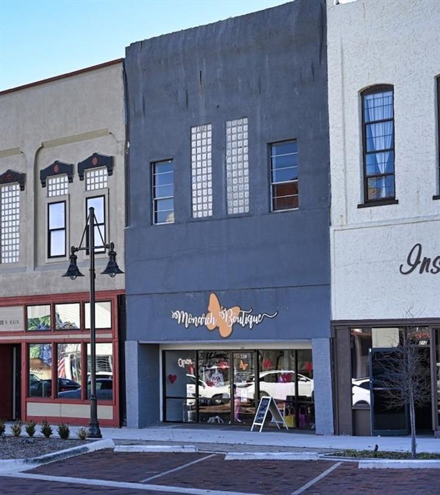 This property offers a prime location on Historic Main Street in Denison, featuring a former boutique space that is ideal for retail use. It includes ample display areas dressing rooms, display windows, while the upstairs provides additional storage. Alley access is available, and the rear parking area is convenient, as it includes a public parking lot. Historic Downtown Denison is ready your business!
Tenant will pay a proration of the taxes.