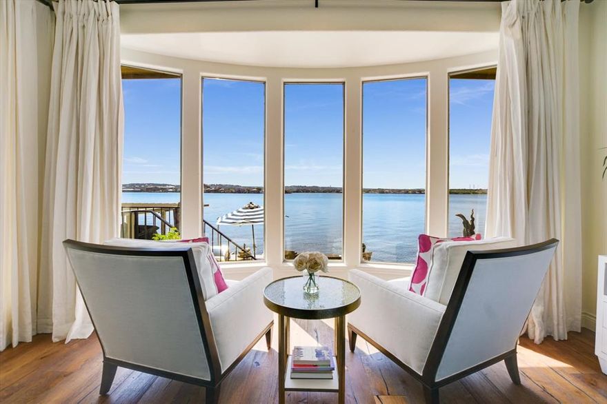 LOCATION LOCATION LOCATION! OPEN WATER ON LAKE LBJ on Iconic Lighthouse Drive. This 5 Bdrm, 5.5 Bath stately home with a rare 3 car garage and parking for up to 11 cars is ideally positioned with North-South exposure. Beautiful open water views from the iron double front doors and massive open water views and direct access to the lake from the back of the house-boat dock-deck. Almost every room in this re-imagined and newly renovated home has a view of Lake LBJ. This home features wide plank engineered hand-scraped wood floors throughout most of the house as well as stone in wet areas and closets, and luxury vinyl flooring in the bunk room and 1bd, 1ba boat house casita. The primary suite features 2 ensuite bathrooms and separate closets and a newly renovated shower. There is a large study off of the entrance and another bonus room off the kitchen & powder room- perfect as another office, hobby room or overflow room for guests. Both bathrooms upstairs have also been renovated with porcelain and quartz. The spacious game room up with wet bar and balcony overlooking lake is shared by two Bdrms, Baths and a bunkroom. There is a newly added turfed area as the side yard, perfect for dogs and ease of cleaning. The outdoor kitchen is off the ovrsz deck is perfect for gatherings, or just enjoying the rays, views, and sunsets. There are 2 hydraulic jet skii lifts and single boat lift. This home is perfect as a full time residence, family lake house, and or a great STR investment opportunity. Come See!