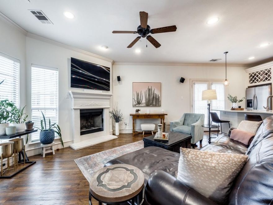 Gorgeous 3 story townhouse-style condo just one block off of lowest Greenville. This two-bedroom end unit features abundant natural light, neutral colors, hand-scraped hardwoods, Nest thermostats, quartz and granite countertops, stainless steel appliances and is walking distance to Trader Joes, Starbucks, HG Sply, GAPCO, Truckyard and so many of the area's staples. Live in one of the few gated communities in the area that also offers a community pool where owners can escape from the Texas heat. Attached 2 car garage plus additional storage space. HVAC replaced 2025.