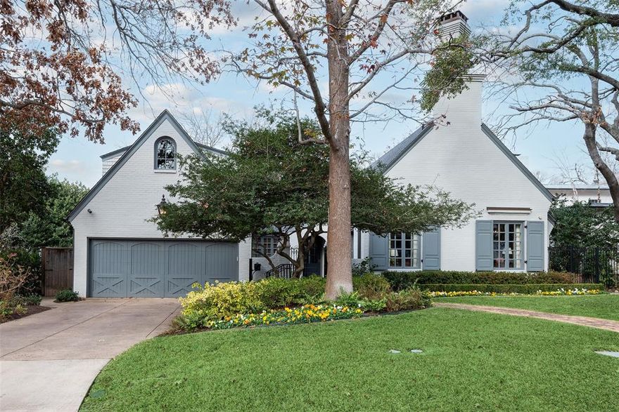 Nothing prepares one for the utter charm and comfort of this immaculately preserved 1939 traditional home sited in one of Dallas’ premier neighborhoods. Overlooking one of the coveted, treed greenbelts, the residence is sited on a lovely 70’ x 135’ lot and has been thoughtfully reimagined by the current owner. The private entry courtyard with fountain hints at what lies beyond. The gracious entry foyer spans the length of the house, offering views of the rear patio and greenbelt through some of the many deeply recessed windows found throughout the house. The warmth of the home envelops you. The entry foyer is flanked by the great room with its beamed cathedral ceiling, central brick fireplace, numerous bookshelves, and bar. Two sets of French doors open to the courtyard and create wonderful flow for entertaining. The immaculately appointed beamed kitchen and the adjoining breakfast-living area are opposite. The central hallway leads to the private primary bedroom suite. French doors open to one of the exterior patios overlooking the yard and greenspace. The formal living room with numerous seating areas is centered around a second fireplace. Past the central hallway staircase and beveled rear door lies the oversized dining room with wonderful space for large gatherings. A graceful staircase leads to two inviting ensuite bedrooms. One is adjoined by a cozy sitting area and a small library with balcony overlooking the great room. A separate staircase leads to a private fourth bedroom and bath in the eves, reminiscent of an enchanting European hotel room. This very special home creates that rare feeling of the way life used to be. Completely remodeled in 2017-2018 with features such as: Lutron lighting; Bosch, SubZero, Wolf Appliances; Quartzite kitchen countertops; 5-inch wood plank floors; meticulous design-finishes-wallpapers; deeply recessed windows; large utility-mudroom; built in outdoor grill; 2 patios overlooking greenbelt; attached 2 car garage.