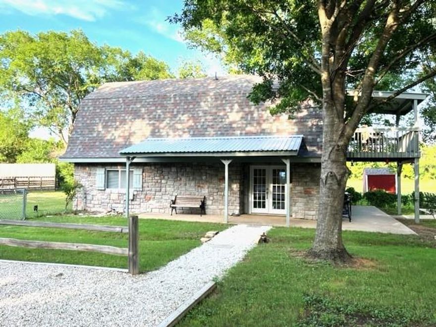 This storybook home features 2 bedrooms and 2.5 baths and is a secluded retreat from the bustle of city life that is just moments away. Located just outside of downtown Burleson, NO CITY TAXES, and minutes from I-35, this newly remodeled home is the perfect place for your family. A few updates include 30 year composition roof, new eaves, fresh paint, french doors, upper deck with added cover, water heater, replastered pool with new sand filter, pump and motor. The list goes on and on. Upstairs offers a wet bar area and room for an in-home office for remote workers. The view from the balcony is serene and looks out to the pond at the rear of the property. Take a dip in the beautifully renovated pool to relax after a hard week. The pool is fully fenced for safety. As an added bonus there is a 20 X 30 shop on a slab that has been updated as well. Washer, Dryer and Refrigerator will convey with sale!
Excludes: Outdoor decorations, Ring cameras, Ring doorbell and Televisions, TV mounts.