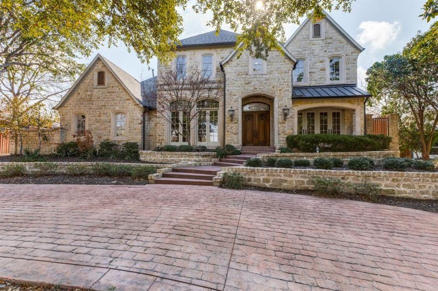 This spectacular custom built home offers both luxury and timeless charm. From the moment you enter the grand staircase and attention to detail is apparent. The primary bedroom suite located on the main level is a private retreat complete with a fireplace and sitting area. The spa like bathroom offers a large walk in shower , double vanity, heated floors,and two over sized closets.  Also on the main level is a secondary bedroom with an en suite bathroom perfect for guests in addition to a private home office  complete with a fireplace and built-in cabinets. The chef's kitchen is well appointed with granite counter tops  and Monogram stainless steel appliances, gas cooking and built in hutch. Upstairs, are two bedrooms and a bonus room. Special amenities include: Circular driveway, three car garage with an electric gate,dog run, wet bar ,high ceilings, crown moldings, tank less water heater, pool, large backyard , and a covered outdoor living area with gas grill. Close to Cooper Aerobics Center, private schools, great restaurants and shopping, synagogues, churches and all major highways.