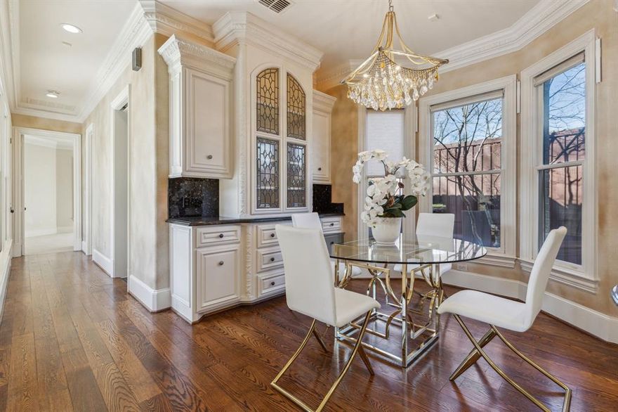 This spectacular custom built home offers both luxury and timeless charm. From the moment you enter the grand staircase and attention to detail is apparent. The primary bedroom suite located on the main level is a private retreat complete with a fireplace and sitting area. The spa like bathroom offers a large walk in shower , double vanity, heated floors,and two over sized closets.  Also on the main level is a secondary bedroom with an en suite bathroom perfect for guests in addition to a private home office  complete with a fireplace and built-in cabinets. The chef's kitchen is well appointed with granite counter tops  and Monogram stainless steel appliances, gas cooking and built in hutch. Upstairs, are two bedrooms and a bonus room. Special amenities include: Circular driveway, three car garage with an electric gate,dog run, wet bar ,high ceilings, crown moldings, tank less water heater, pool, large backyard , and a covered outdoor living area with gas grill. Close to Cooper Aerobics Center, private schools, great restaurants and shopping, synagogues, churches and all major highways.