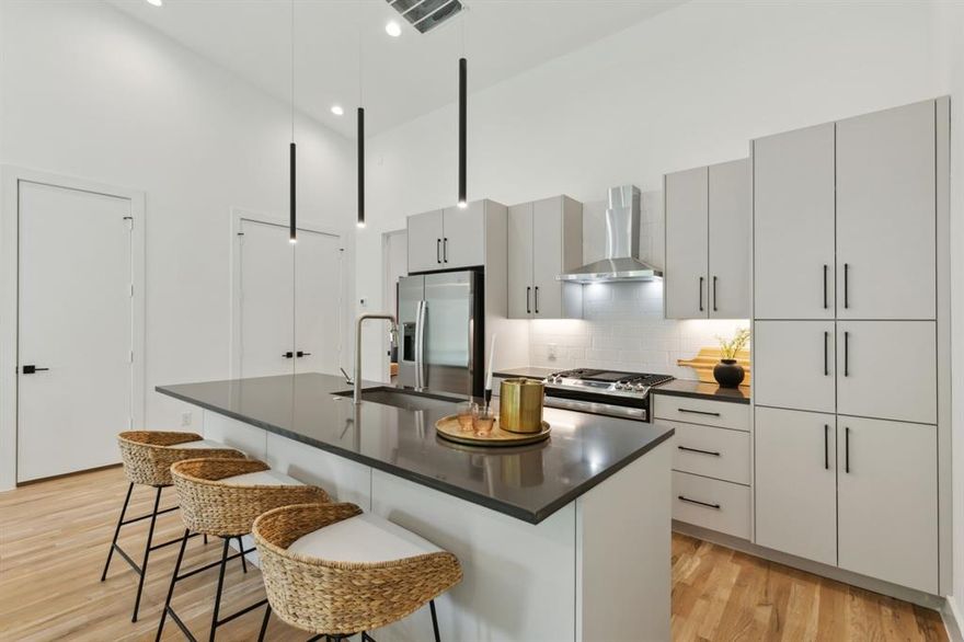 Don't miss your opportunity to call the Rise at WOLO home, where contemporary design meets comfort. These two-story condos offer a perfect blend of sleek modern finishes and warm wood accents. With thoughtfully designed spaces that maximize natural light and high ceilings that create an airy, open atmosphere, every detail has been carefully considered. The second floor boasts soaring vaulted ceilings, rich wood floors, and a kitchen adorned with custom cabinetry. The primary suite features a luxurious oversized walk-in shower, a double vanity with quartz countertops, and a spacious walk-in closet with custom built-ins. Just minutes from Medical District, Inwood Village, Downtown, and more. The Rise at WOLO is a unique opportunity to embrace modern living in Dallas. Come see it for yourself today!