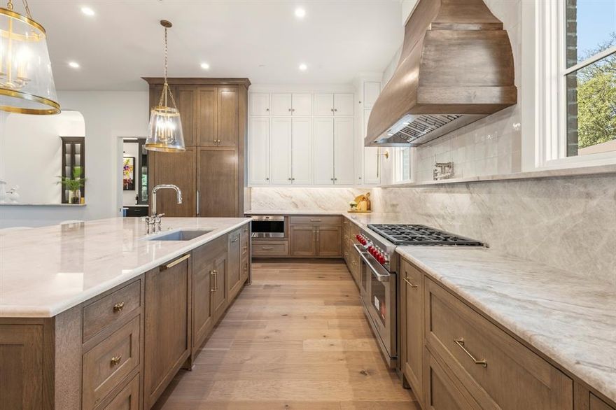 Exquisite New Construction in Melshire Estates – 7,120 Sq. Ft. Luxury Estate

This stunning new build in Melshire Estates offers 7,120 sq. ft. of luxury living on an oversized lot with expansive front and back yards. Designed for both elegance and everyday comfort, the open-concept layout features soaring ceilings, wide-plank hardwood floors, and abundant natural light. 
At the heart of the home, the gourmet kitchen showcases Taj Mahal quartzite countertops, a waterfall island, custom cabinetry, professional appliances, and a walk-in butler’s pantry. The seamless flow into dining and living areas makes this space ideal for entertaining.
The primary suite is a private retreat with spa-inspired bath, soaking tub, oversized shower, dual vanities, and a custom designer closet with built-ins and center island. Additional ensuite bedrooms provide comfort for family and guests.
Upstairs offers a game room, media room, and flexible living areas perfect for work or play. Outdoor living includes a covered patio overlooking a spacious backyard with room for a pool or garden.
Located near Preston Hollow, the Galleria, and premier shopping and dining, this home combines timeless architecture, modern finishes, and an exceptional North Dallas location.

7,120 sq. ft., Taj Mahal Counters,  Butler’s Pantry,  Game & Media Rooms,  Oversized Lot