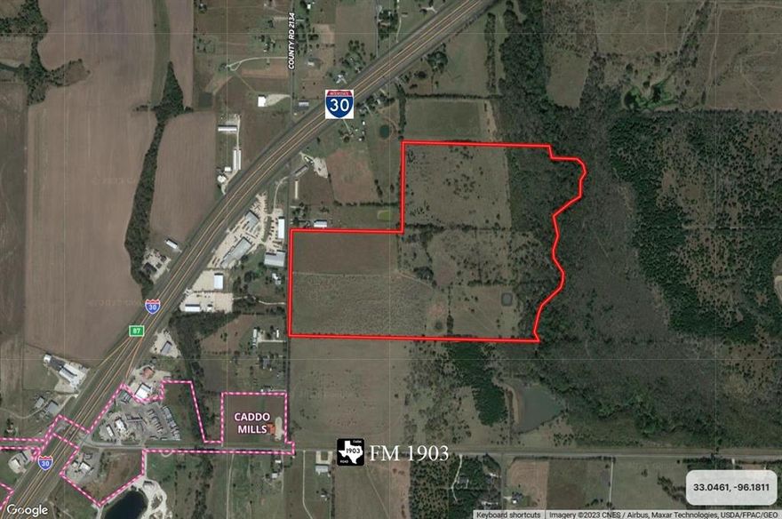 Beautiful acreage in the ETJ of Caddo Mills with a mixture of hay pasture, trees, ponds and a creek with mature trees in the back. Highly accessible property situated between Interstate Highway 30 and FM 1903 with over 1,000 feet of frontage on County Rd 2172. Located approximately one-half mile from the interchange at I-30 and FM 1903 where a sanitary sewer line extends to service McDonalds and several gas station-convenience stores. Caddo Mills is an actively developing community with a new state-of-the-art high school facility on FM 36. Ag Lease and Ag Tax Exemption in place. Informational package available upon request.