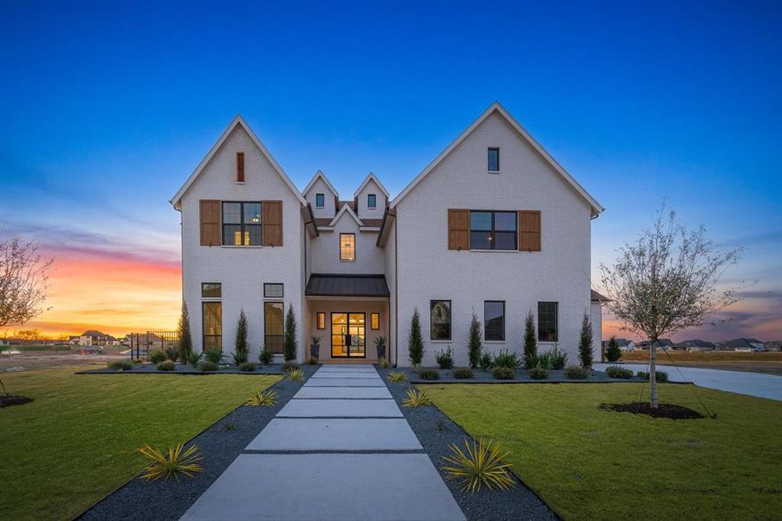 The stunning executive home is located in highly acclaimed community -The Resort on Eagle Mountain Lake. This home backs to a canal with lake access. This fabulous home boast 5 bedrooms, all of which have ensuite baths!  Two bedrooms, including the primary are on the first floor. The first floor main living area is huge open concept that opens to the back patio with future pool and canal access. Upstairs living features huge game room that opens to a large balcony that overlooks the pool and canal. Large media room and 3 secondary bedrooms complete the second floor of this outstanding home. This home is a must see and will not last long!