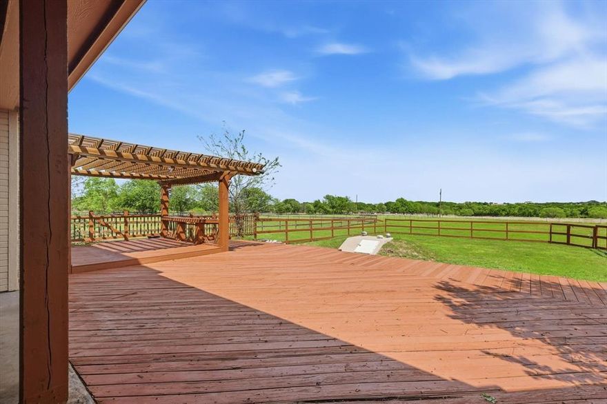 Welcome to 4430 Bucking Bronc Dr in Benbrook, Texas, where peaceful country living meets everyday convenience just minutes from Fort Worth. Situated on 1.47 acres with no neighbors behind, this 3,258 square foot home offers the rare combination of privacy, space, and breathtaking open-sky views that are becoming harder to find in the Benbrook area.

From the moment you arrive, you’ll notice the expansive front yard, long driveway, and stately curb appeal complemented by a desirable 3-car garage. Inside, the home offers a functional and flexible layout featuring 4 bedrooms, 3 full bathrooms, a formal living room, and a dedicated dining space perfect for gatherings, holidays, or quiet evenings at home. Natural light pours through oversized windows, creating a warm and inviting atmosphere throughout.

The upstairs private suite with a full bath provides incredible versatility. It is ideal for multi-generational living, a private guest retreat, or a quiet home office setup away from the main living areas.

Step outside and experience what truly sets this property apart.

The oversized deck and pergola create the perfect setting for relaxing evenings, morning coffee, or entertaining under wide Texas skies. With uninterrupted views and no rear neighbors, you’ll enjoy a level of peace and privacy that defines true rural living. The property also includes a storm shelter, adding an important layer of safety and peace of mind.

Located in the highly desirable Benbrook area, you are just minutes from local favorites like Dutch Branch Park, Benbrook Lake, and Whitestone Golf Club, offering easy access to outdoor recreation, walking trails, and golf. Enjoy the balance of quiet country living while still being a short drive to shopping, dining, and major routes into Fort Worth.

If you’ve been searching for a home with land, views, and true privacy in Benbrook TX, this is the one that delivers.