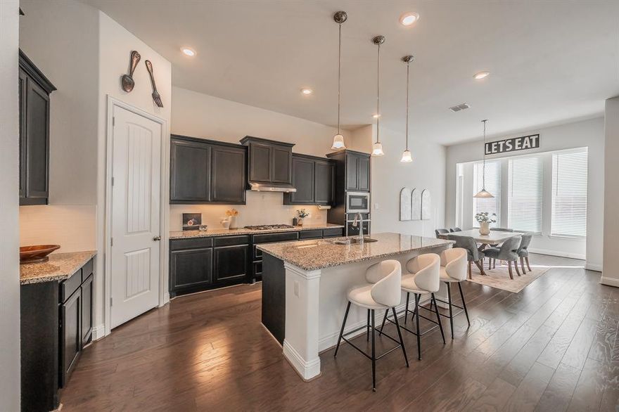 Amazing and affordable MULTI-GENERATIONAL home in the highly desirable Caraway community in Haslet! Assumable 2.625% mortgage option available, ask listing agent for details. Located just off I-35 and Highway 170 with easy access for commuters, you can't beat the convenience of this area. North facing home keeps temperatures more balanced. With over 2,700 square feet total, the main part of the home offers 3 bedrooms, 2 bathrooms, and a private office with french doors, while the Next Gen suite offers 1 bedroom, 1 bathroom, a living area, full kitchen and laundry room. This is the perfect layout for aging parents, a young adult or even an office or studio space. As you enter the home, you will notice the soaring ceilings, beautiful wood flooring, open floor plan and great natural lighting. The kitchen, living room and dining area create one massive area for entertaining guests. The primary suite is located at the rear of the house and offers a luxurious bath with dual vanities, garden tub, separate shower and large walk-in closets. The secondary bedrooms are located down a separate hallway for maximum privacy. Outside, you'll enjoy sitting on the covered patio and the high fencing in the back that creates a feeling of distance from the neighbors. Walk to the community pool and playground. HOA dues include front yard maintenance. Minutes to the Alliance Town Center and Shops at Presidio. Don't miss this wonderful opportunity to own 2 homes in 1! Please see agent for special conventional financing program with up to a 3% grant towards closing costs.