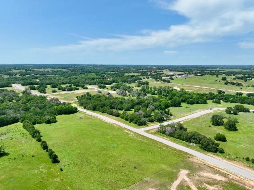 Discover the tranquil country lifestyle you've always dreamed of without leaving behind the career you've worked so hard to establish. Welcome to Sarra Ranch Estates, a private community offering 2–4 acre lots, just a short 35-minute commute from Fort Worth. Sarra Ranch gives you the rare chance to experience the best of both worlds—peaceful country living with stunning views of towering oak trees and rolling hills, while still being close to the conveniences of city life. The community is lightly deed restricted with no HOA, allowing you the freedom to choose your own builder and construction timeline. Workshops are also welcome. This is your opportunity to make your dream a reality. The property features paved roads, underground utilities, and high-speed fiber optic internet. Build your family’s future at Sarra Ranch Estates, located within the Poolville and Weatherford ISD. Barndominiums are not permitted. PHOTOS DISPLAYED ARE PHOTOS OF THE ENTIRE DEVELOPMENT NOT INDIVIDUAL LOTS