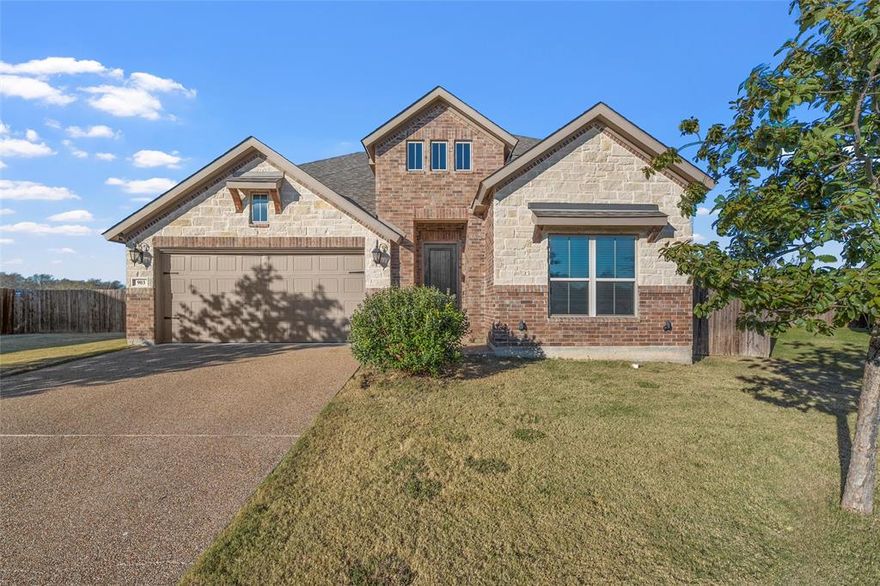 Welcome to 903 Dublin Ct, a stunning two-story home tucked away on a peaceful cul-de-sac in the heart of McGregor, TX. Built in 2019, this spacious residence offers 6 bedrooms and 4 full bathrooms, including the unique potential for two primary suites, perfect for multi-generational living, guests, or flexible lifestyle needs. Step inside to discover two inviting living spaces, ideal for gathering or relaxing, anchored by a charming wood-burning fireplace that adds warmth and character. The open-concept kitchen flows seamlessly into the main living area, offering an ideal layout for large gatherings. Upstairs and down, the home provides abundant space, privacy, and comfort for everyone. Outside, enjoy a covered back patio, perfect for morning coffee, along with neighborhood sidewalks that promote easy strolls and added safety. This home delivers the privacy you want with the convenience you need. All in a beautifully designed modern build. 903 Dublin Ct offers exceptional space, thoughtful features, and a welcoming setting, ready to become your next home!
