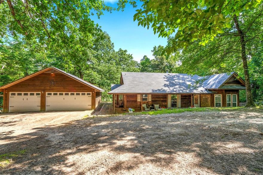 Secluded 3 bedroom 2 bath home surrounded on all 4 sides by woods with no potential for building behind. This home also features a bonus room off the Primary bedroom that could function well as an office space, nursery, or an indoor sitting area to enjoy the beautiful view. The 3 car garage also has plenty of space for storage and a workshop. Both bathrooms have been updated with quartz counter tops and tile showers. Primary bath has His and Hers walk-in closets. The kitchen has also been updated with quartz countertops, a stainless farmhouse sink, counter depth fridge for optimal space, a corner pantry and corner lazy-susan cabinetry. Enjoy the seclusion of this home and beautiful views of the wildlife from any of the 3 expansive porch areas. Holly Lake Ranch is a private, gated, HOA-managed community boasting many amenities for our residents and providing 24-hour on-site security services. One of our most prized amenities is our 18-hole Leon Howard-designed golf course complete with putting green, driving range, and Pro Shop. Additionally, Holly Lake Ranch has five private lakes ranging in size from a couple hundred acres to just a few acres, suited to a variety of activities including fishing, swimming, skiing, and recreational boating. Many other amenities are available for our residents to enjoy, such as tennis and pickleball courts, nature trails, a gun range, a fitness center, swimming pools, a restaurant, a private airport, and many more.