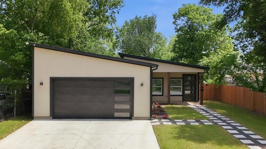 Not your typical new build, this 2024 home delivers a level of finish and detail you don’t expect to find at this price point. From the moment you walk in, the space is set up to impress with hardwood floors, a clean open layout, and a living area designed for entertaining. In-wall speakers, a ceiling-mounted TV, and a dedicated bar with wine and beverage cooler create a built-in hangout space that’s ready from day one.
The kitchen keeps the same energy with solid wood cabinetry, black quartz countertops, and a full LG appliance package including a gas cooktop and smart wall oven with air fry and convection.
Bathrooms feel more like a boutique hotel than standard new construction. Floating vanities, LED mirrors, and statement tile work carry throughout, while the primary suite takes it a step further with a jetted tub with lighting, a rainfall shower, and added privacy features that make it feel like its own retreat.
Beyond the finishes you can see, the home was built with intention, from upgraded climate control and insulation to an insulated garage and quiet ventilation systems.
Located just minutes from Downtown, Deep Ellum, and Fair Park, this is a rare opportunity to own a nearly-new home with standout features and a style that’s hard to replicate.