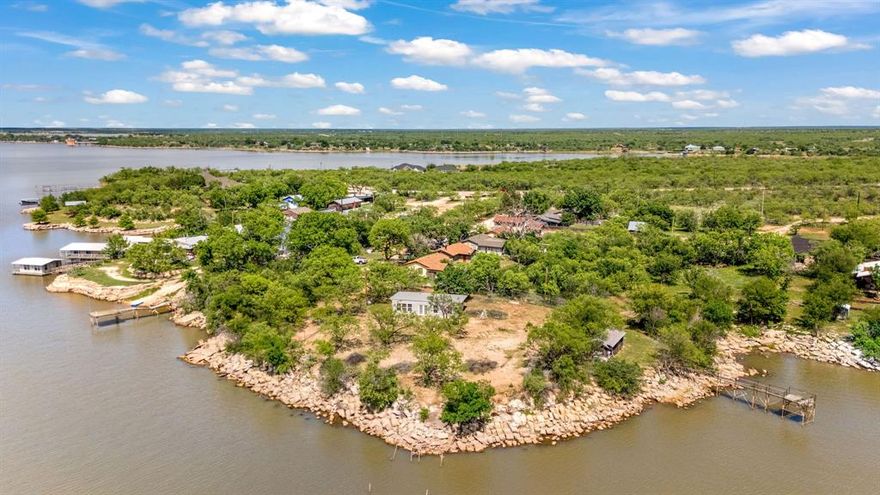 Rare opportunity to own a piece of waterfront property on Fort Phantom Lake! This 800 sq ft gem has been taken down to the studs and is ready for your vision. Currently configured as a 1 bed, 2 bath, the hard work has already begun with newer windows, and metal roof. The back patio rivals the home itself, perfect for soaking in the 180 degree waterfront views and breathtaking sunsets from the heart of the lake. Whether you're dreaming of a weekend escape or a full time retreat, this place is your blank canvas. Come make your lake dreams a reality!