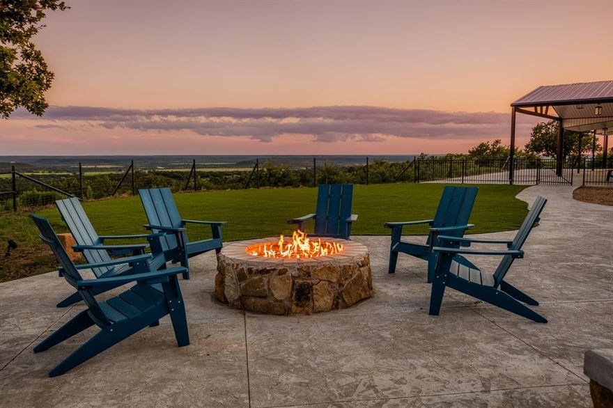 Welcome to Running Dog Ranch, an extraordinary 373-acre luxury estate nestled in the rolling hills of Young County. Designed for the discerning outdoor enthusiast, this premier North Texas property offers one of the finest hunting and recreational facilities in the region.
Built in 2022, the 3,196 sq. ft. main house sits atop a high ridge with dramatic elevation changes, offering sweeping panoramic views of the surrounding countryside. The home features:
• 5 spacious bedrooms and 5 bathrooms 
• Soaring vaulted ceilings and two fireplaces 
• A gourmet kitchen with guartz countertops, stainless steel appliances, and extensive custom cabinetry
• Expansive windows that bring the outdoors in with natural light
Steps from the main home lies a 4,800 sq. ft. custom-designed barndominium that serves as a game lodge, guest quarters, and entertainment center. It includes:
• 3 additional bedrooms, 2 full bathrooms, and a full second kitchen
• A dedicated pickleball court and ample space for game tables, gatherings, and celebrations
Private resort-style pool featuring:
• A hot tub, waterfall, slide, diving rock, and ambient nighttime lighting
• Automated safety covers for both the pool and spa, ensuring safety and cleanliness year-round
Running Dog Ranch is a hunter’s paradise, thoughtfully developed with:
• Established roads, feeders, and blinds
• Thriving populations of whitetail deer, red stag, wild pigs, turkey, and varmints
• Mature oak trees, two stocked ponds, and natural water sources enhancing habitat quality
• A 2,000 sq. ft. equipment barn for storing UTVs, feed, and gear
• Miles of improved ranch roads ideal for exploring or managing land
• Just 10 minutes from historic Graham, 20 minutes from Possum Kingdom Lake, and under 2 hours from Fort Worth
 This is more than a property—it’s an experience that must be seen to be truly appreciated.your private tour today. Properties of this caliber are rarely offered and never last.