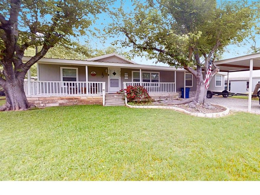Discover the perfect waterfront getaway in this beautifully updated, move-in-ready home nestled in a quiet lakeside neighborhood. This 3-bedroom, 2-bath property offers an inviting open-concept living area, a versatile bonus room, and a spacious screened-in porch ideal for relaxing and taking in the views. Private boat dock plus outdoor storage area for extras. Enjoy evenings around the fire pit in the backyard, perfect for story telling and s'mores! The home has been completely updated and is offered FULLY FURNISHED—just bring your toothbrush and start enjoying lake life immediately. With direct waterfront access and a layout designed for comfort and convenience, this is a rare opportunity you won’t want to miss. 
Waterfront homes like this don’t come available often. Make it yours and start living the lakefront lifestyle. Can function as an income producing property as a STR. Boat available for sale separately.